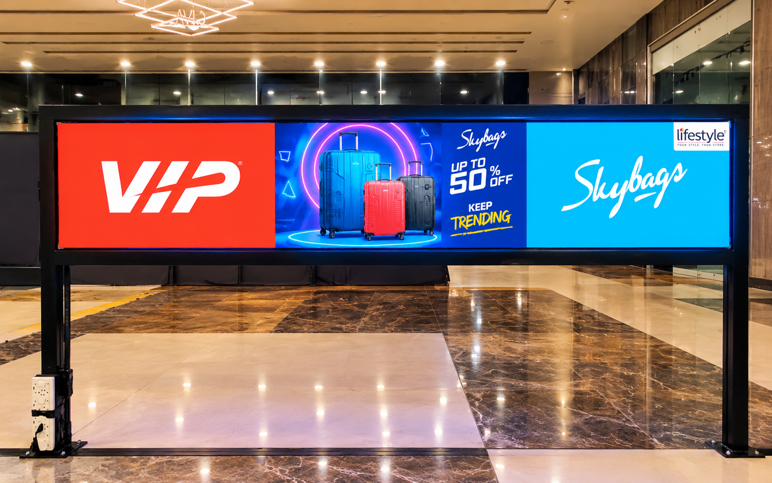 Illuminated Luggage Billboard in Modern Concourse